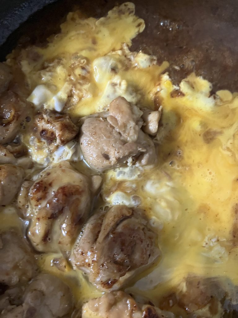 Pan covered and oyakodon simmering on low heat